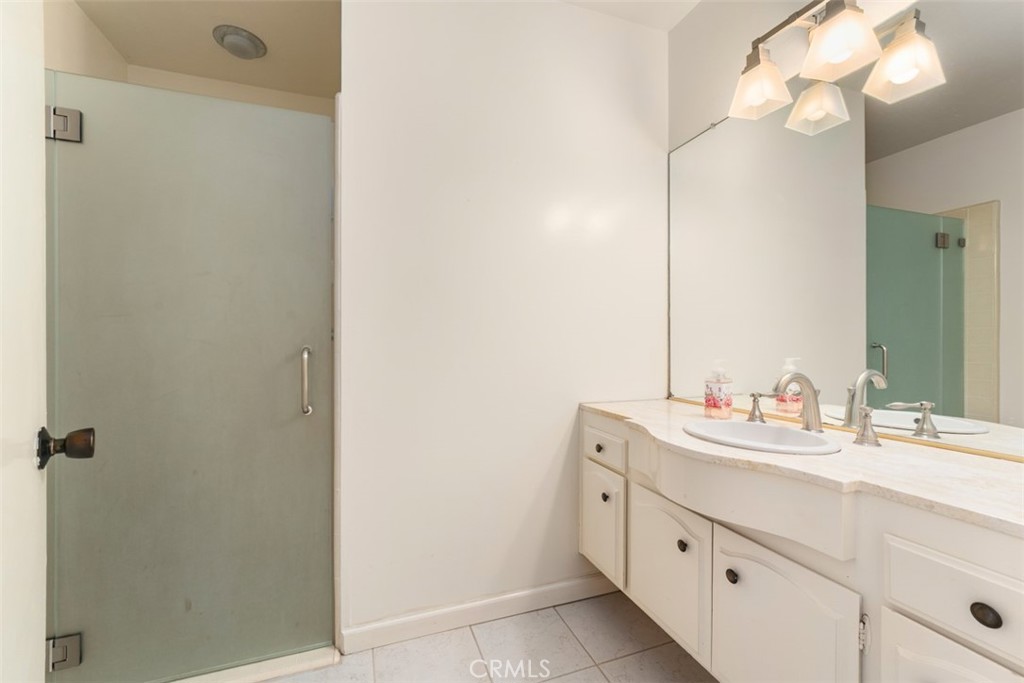 10 Rue Valbonne Newport Beach, CA 92660 - Photo 10 of 66 a bathroom with a double vanity sink and a mirror