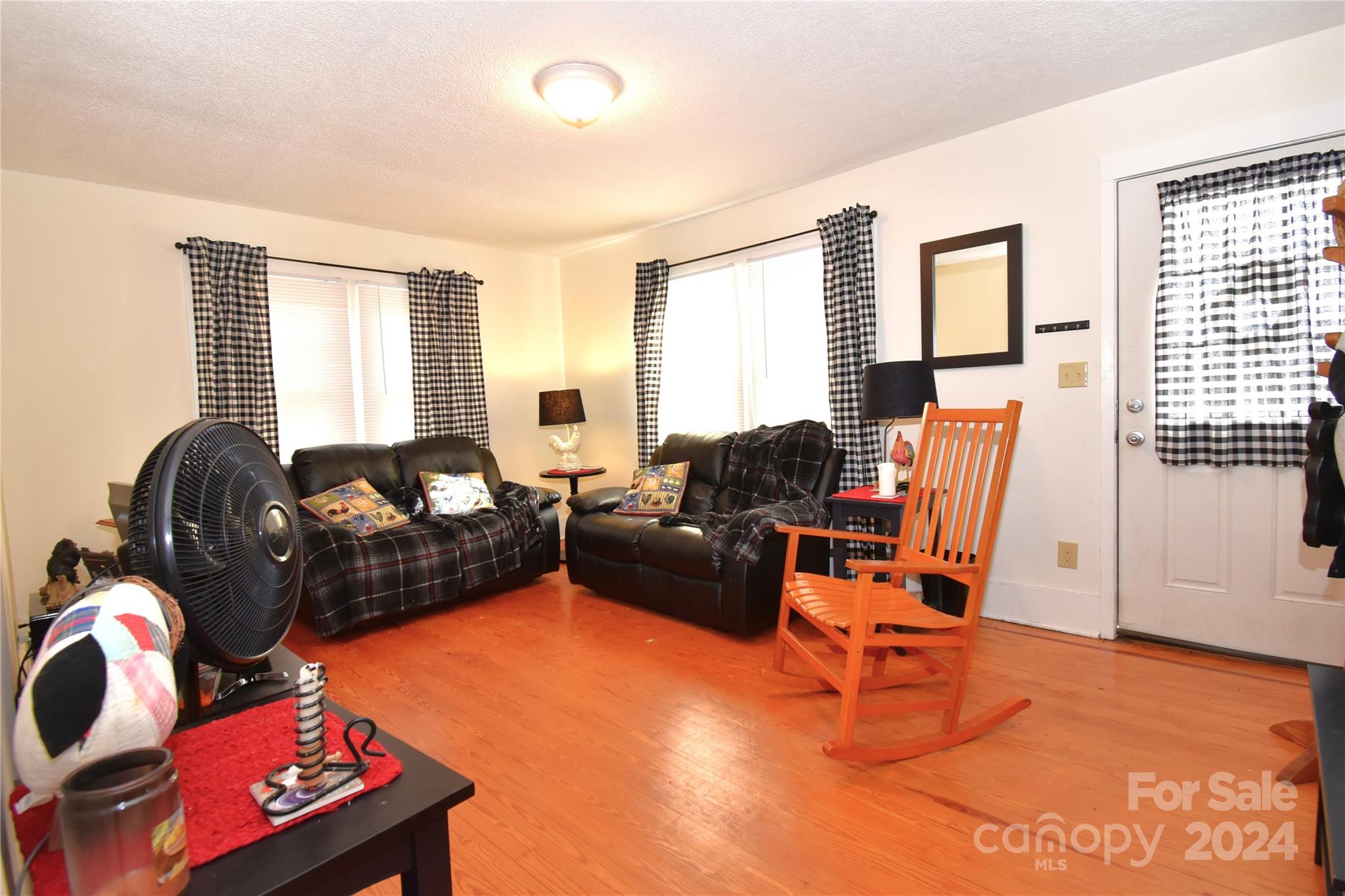 116 Warner Road Canton, NC 28716 - Photo 2 of 22 a living room with furniture a flat screen tv and a window