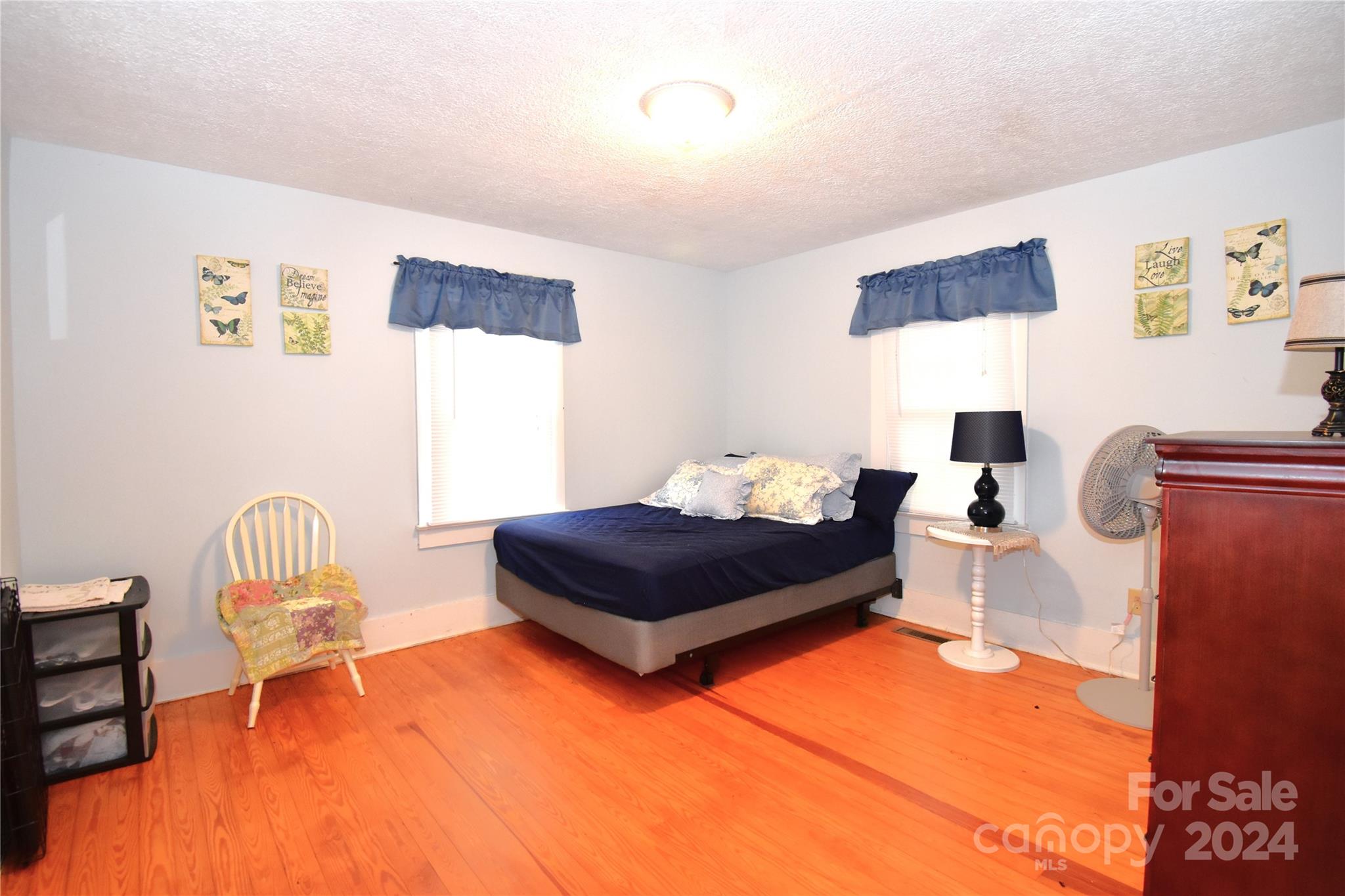 116 Warner Road Canton, NC 28716 - Photo 8 of 22 a living room with furniture a rug and a wall painting