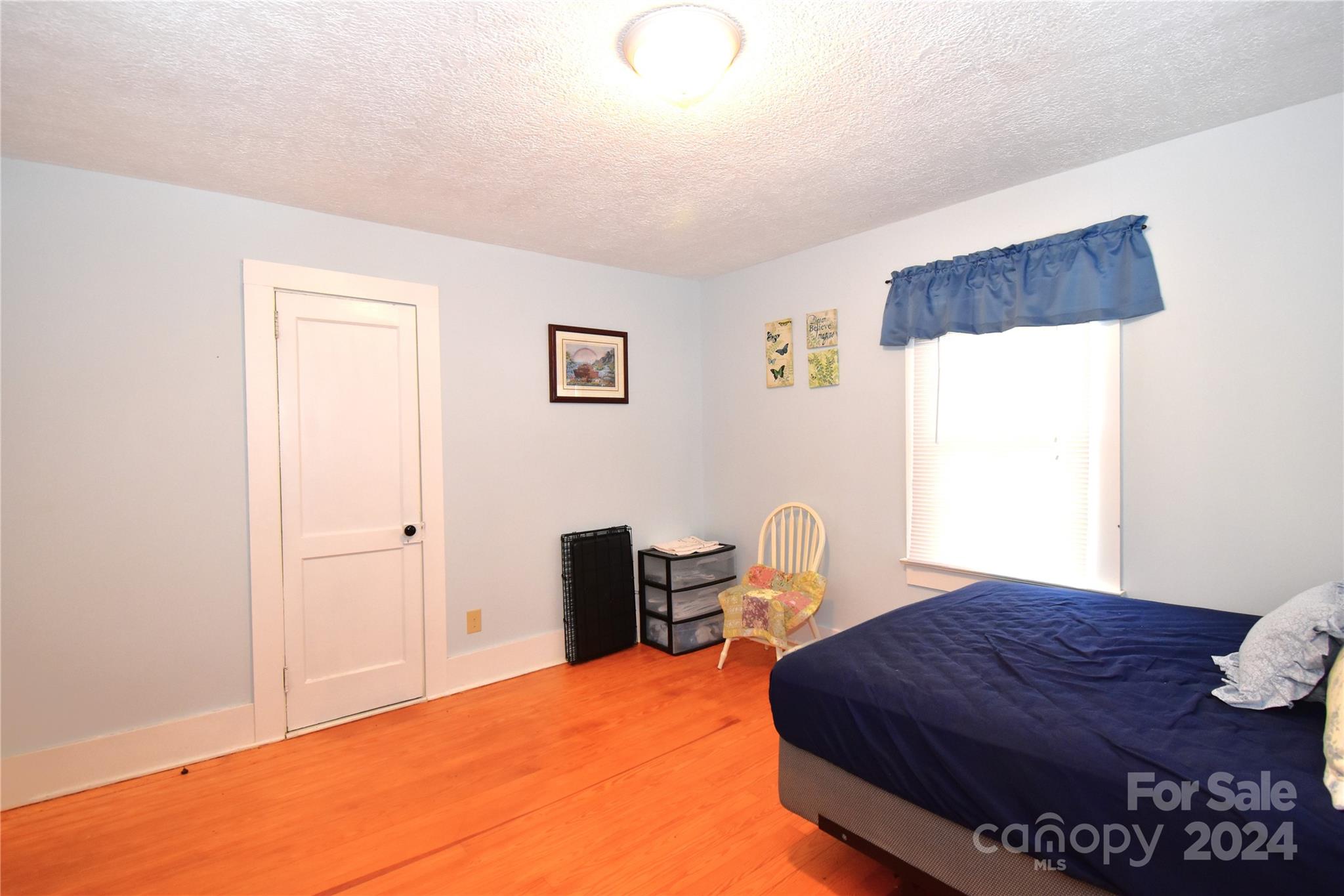 116 Warner Road Canton, NC 28716 - Photo 9 of 22 a bedroom with a bed and a dresser in it