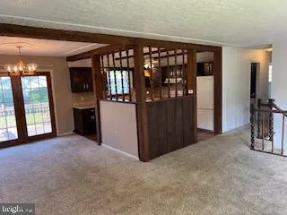 a view of a house with a wooden deck