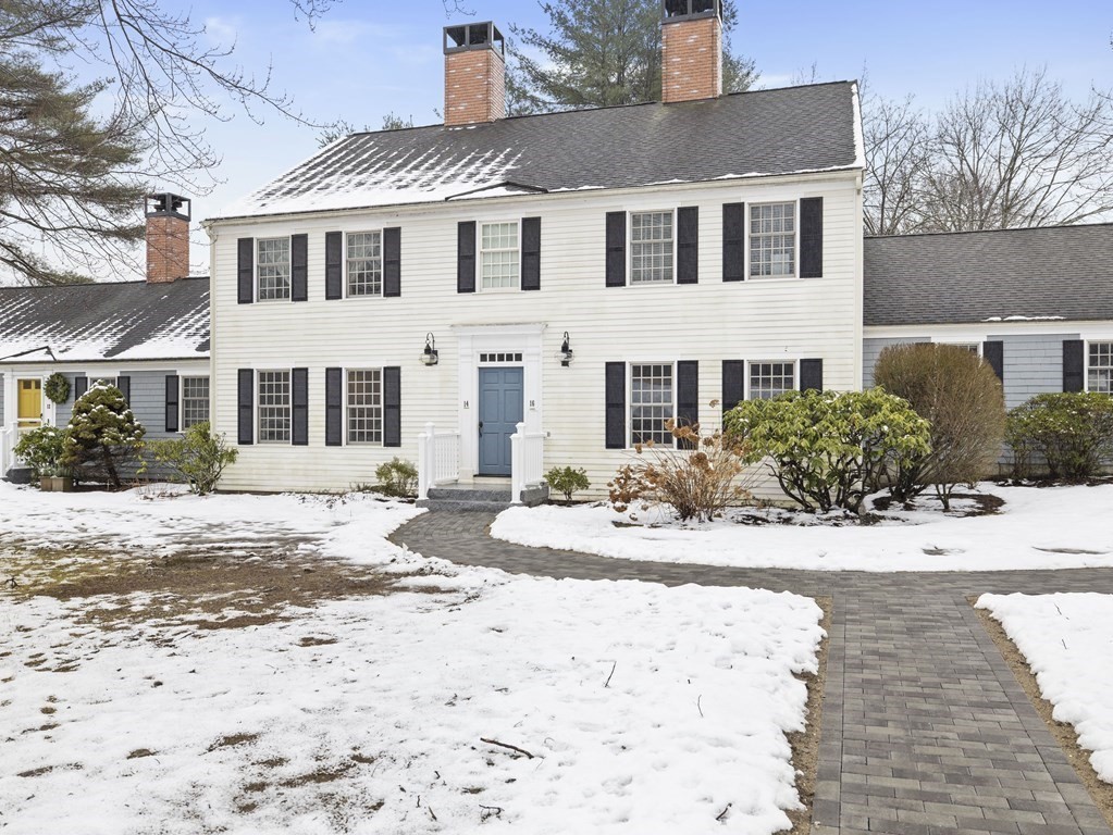 14 Jericho Road, Unit 14 Weston, MA 02493 - Photo 1 of 17 a front view of a house with a yard