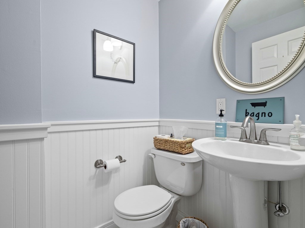 14 Jericho Road, Unit 14 Weston, MA 02493 - Photo 14 of 17 a bathroom with a toilet a sink and a mirror
