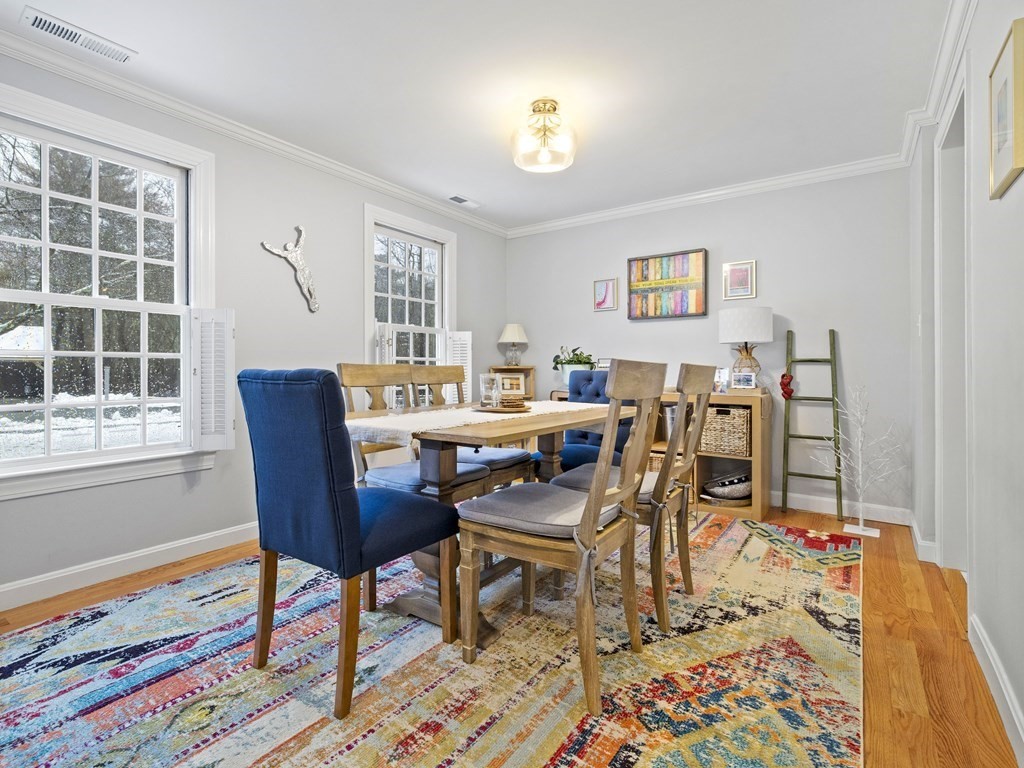 14 Jericho Road, Unit 14 Weston, MA 02493 - Photo 2 of 17 a view of a dining room with furniture and wooden floor