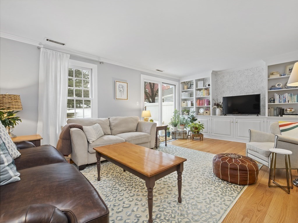 14 Jericho Road, Unit 14 Weston, MA 02493 - Photo 6 of 17 a living room with furniture and a flat screen tv