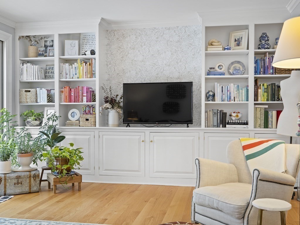 14 Jericho Road, Unit 14 Weston, MA 02493 - Photo 7 of 17 a living room with furniture and a flat screen tv