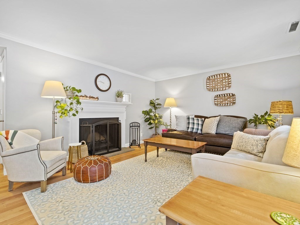 14 Jericho Road, Unit 14 Weston, MA 02493 - Photo 8 of 17 a living room with furniture and a fireplace