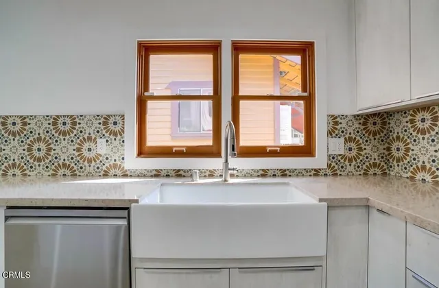 a bathroom with a sink and a window