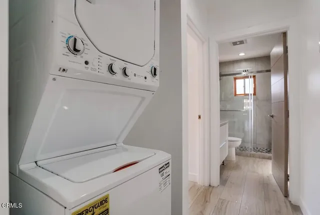 a view of a hallway with washer and dryer