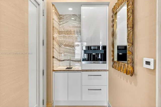 a bathroom with a double vanity sink and mirror