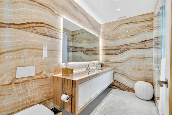 a bathroom with a bathtub and shower