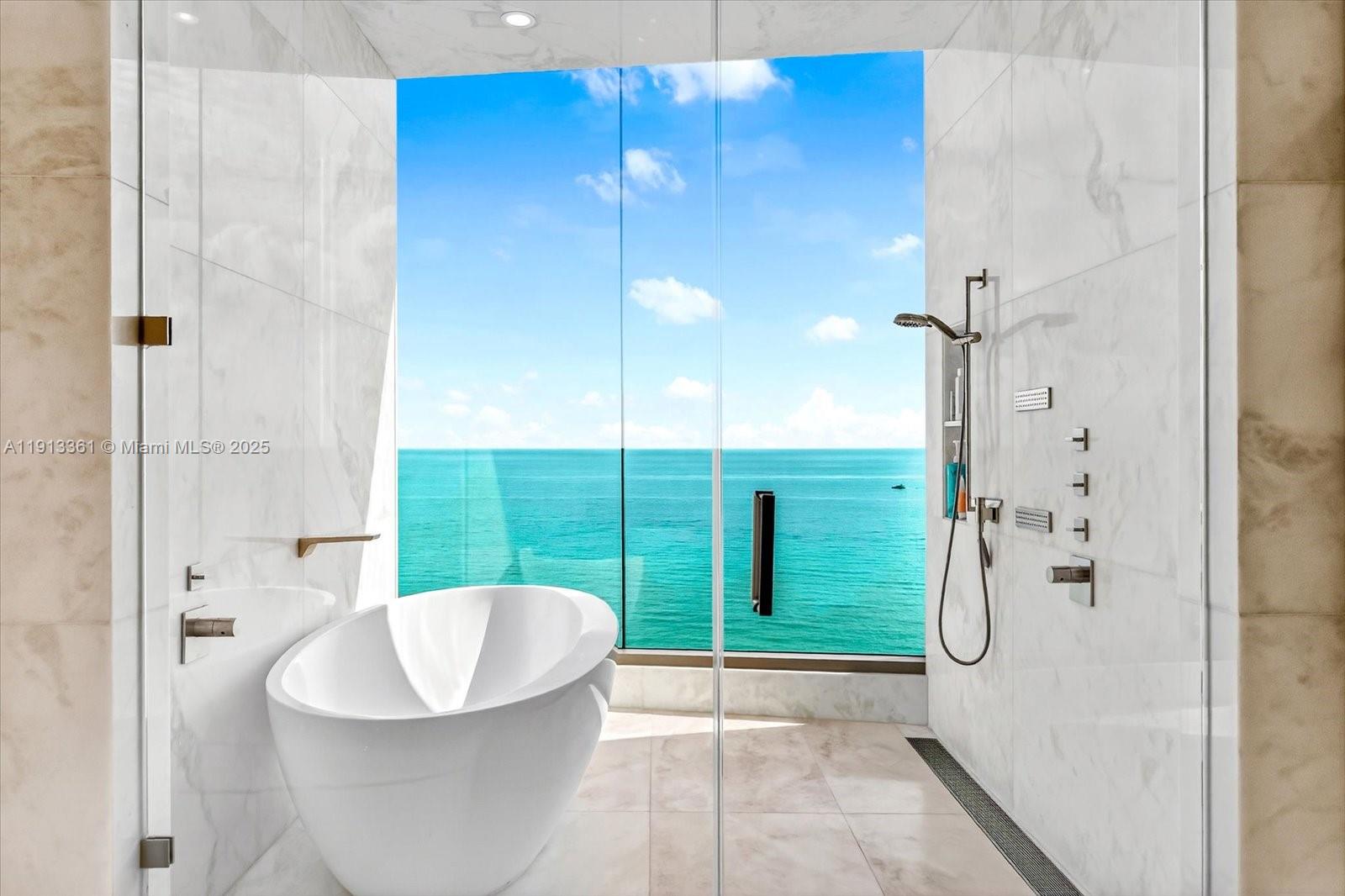 17901 Collins Avenue, Unit 2004 Sunny Isles Beach, FL 33160 - Photo 37 of 55 a bathroom with a bathtub and shower