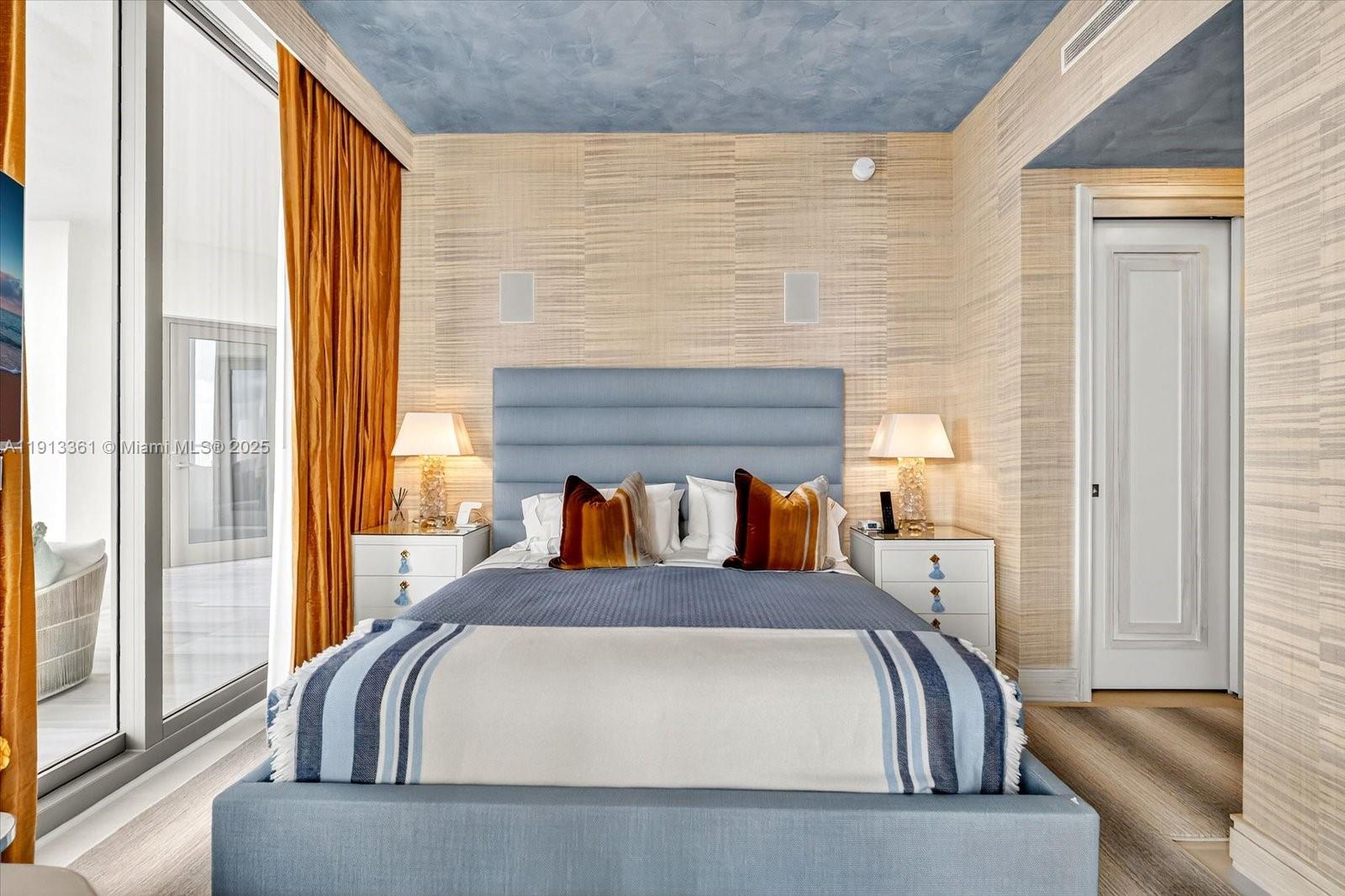 17901 Collins Avenue, Unit 2004 Sunny Isles Beach, FL 33160 - Photo 44 of 55 a bed sitting in a bedroom next to a window