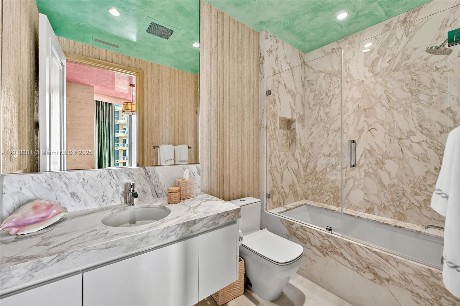 17901 Collins Avenue, Unit 2004 Sunny Isles Beach, FL 33160 - Photo 46 of 55 a bathroom with a granite countertop sink and a mirror