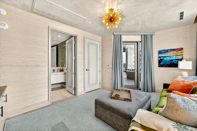 a bathroom with a sink vanity mirror and toilet