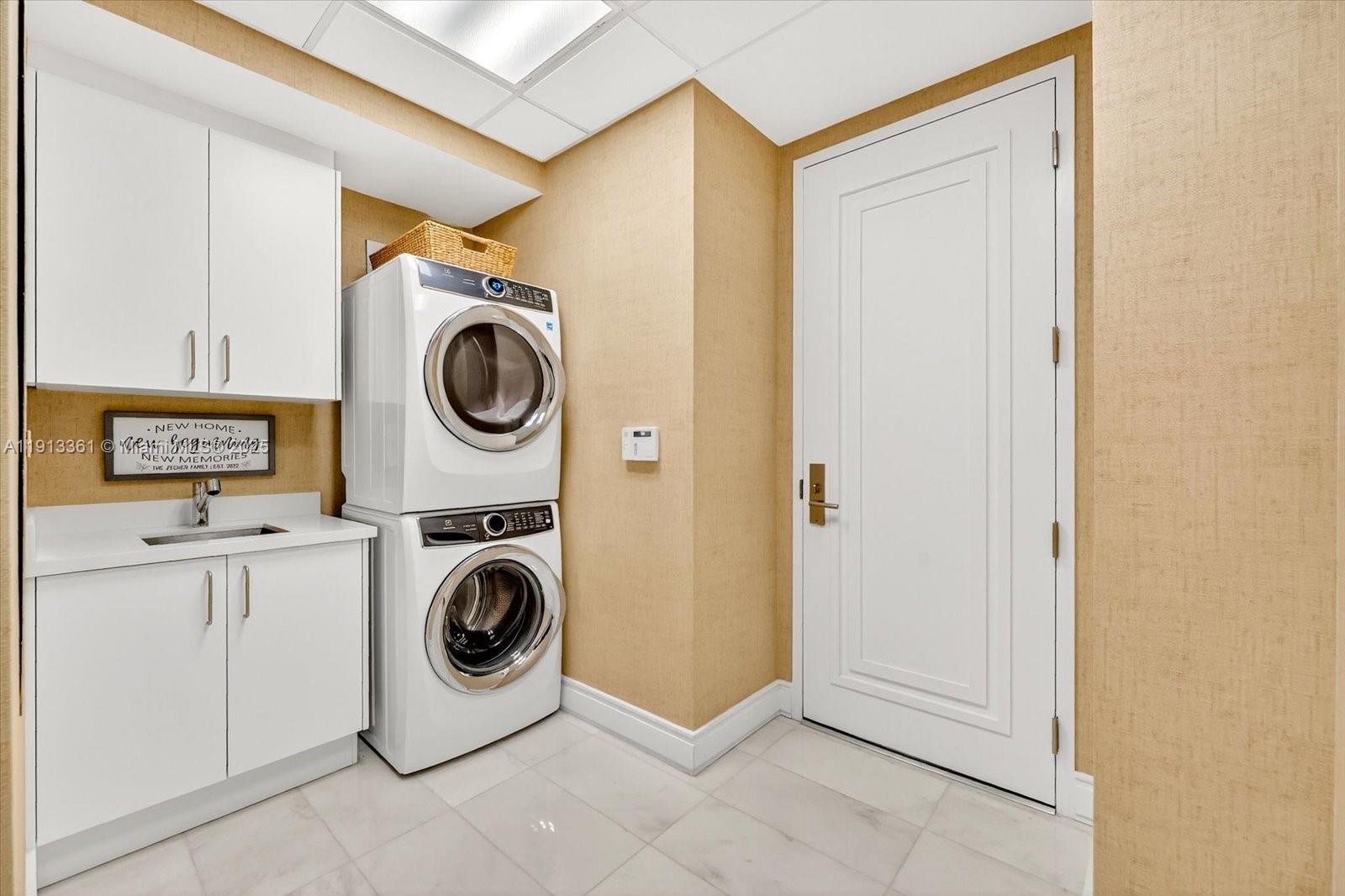 17901 Collins Avenue, Unit 2004 Sunny Isles Beach, FL 33160 - Photo 50 of 55 a utility room with dryer and washer