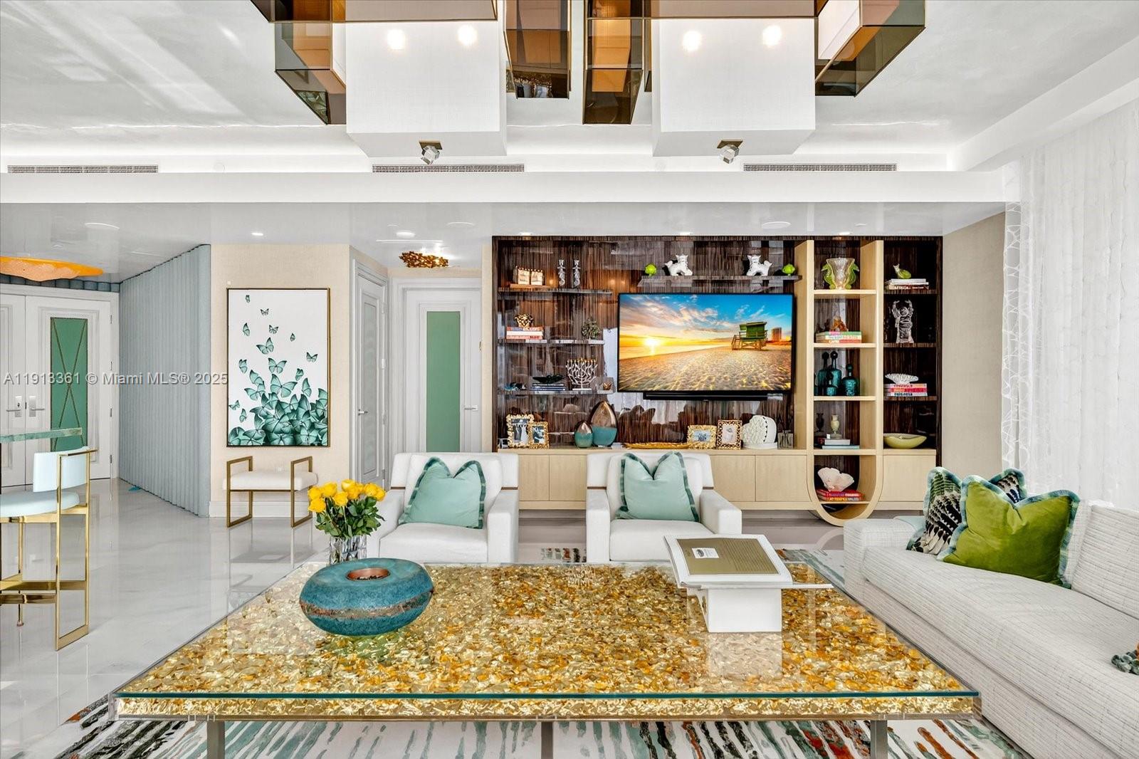 17901 Collins Avenue, Unit 2004 Sunny Isles Beach, FL 33160 - Photo 6 of 55 a living room with furniture and a potted plant