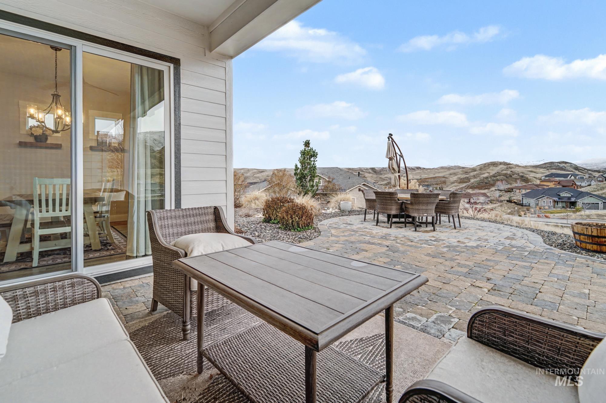 18357 North Burnt Car Way Boise, ID 83714 - Photo 32 of 48 View of patio featuring outdoor dining space and a mountain view
