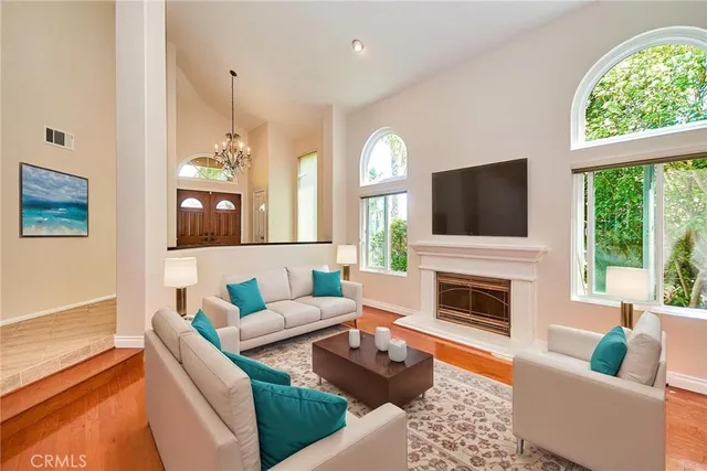 a view of a room with window and wooden floor