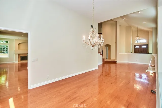 a kitchen with a refrigerator and a stove top oven