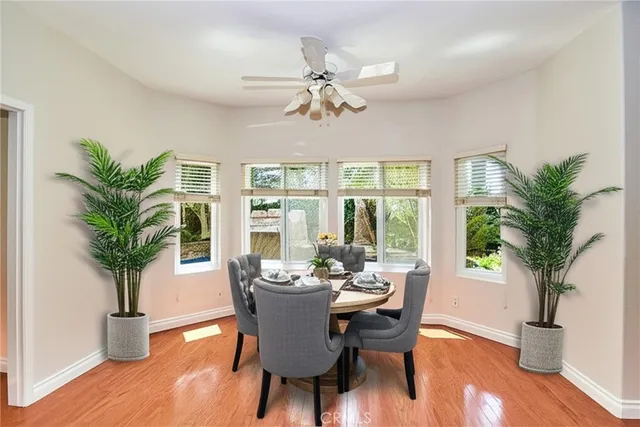 a view of kitchen with furniture and wooden floor