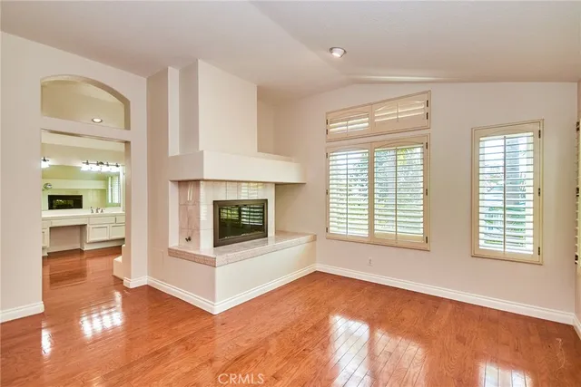 a spacious bathroom with a tub sink and mirror