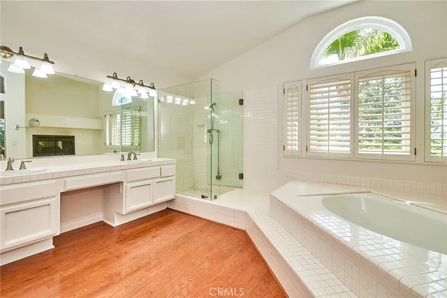 a view of a bathtub in a room with a fireplace