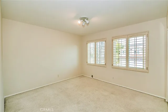 a front view of a house with yard and sitting area