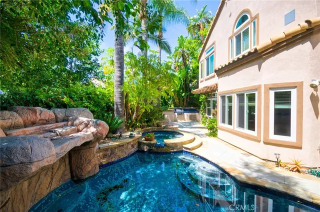 a view of a swimming pool with a patio