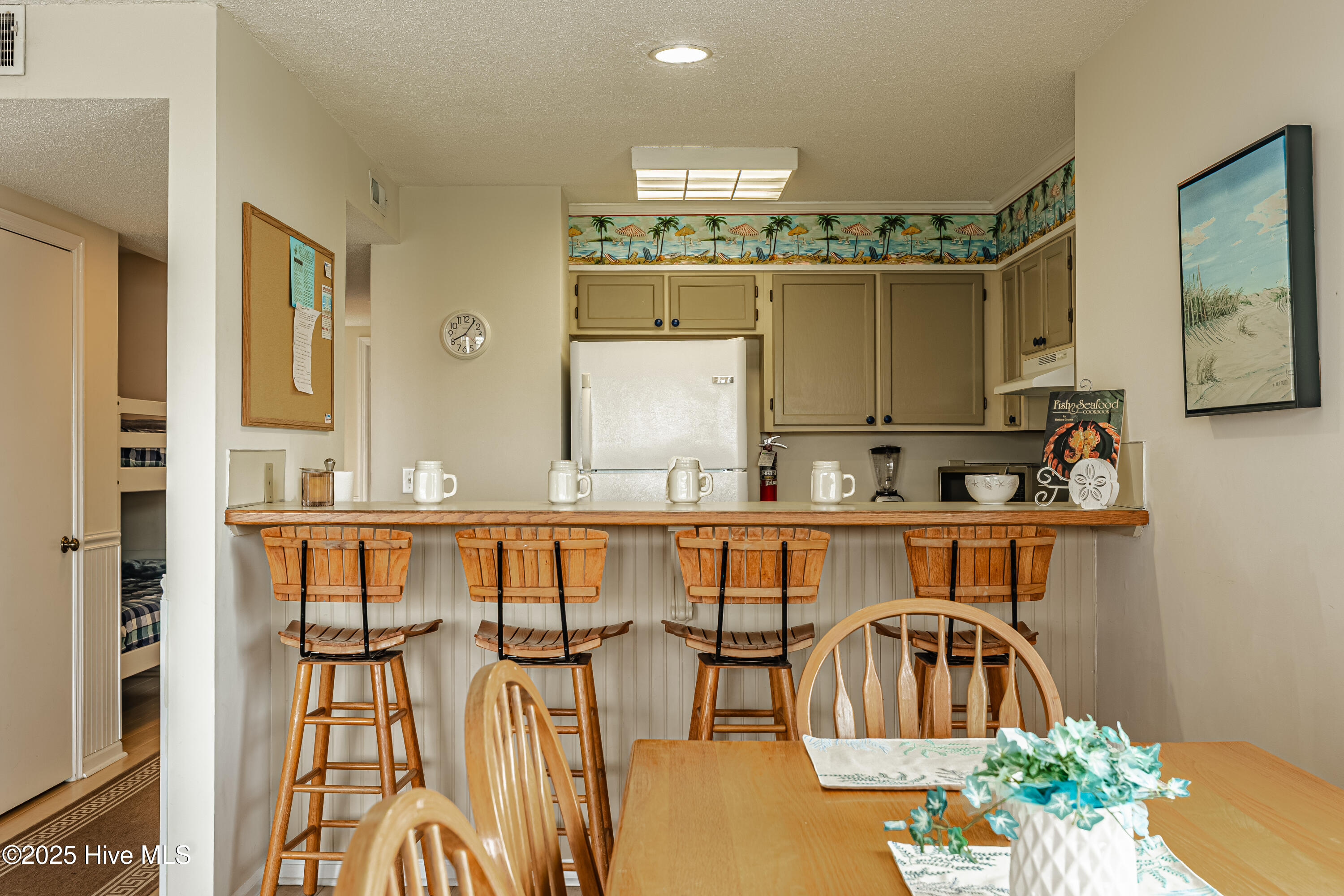 4 Seabrook Road, Unit 1 Ocean Isle Beach, NC 28469 - Photo 7 of 37 Dining area and kitchen