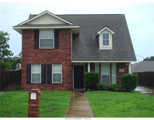 2425 Pintail Loop College Station, TX 77845 - Photo 1 of 1 a front view of a house with garden