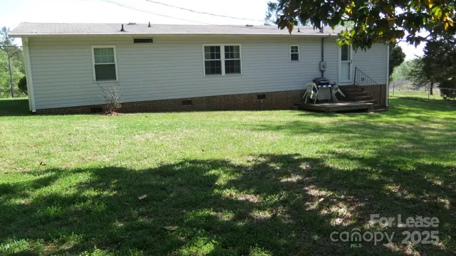 a backyard of a house with a garden