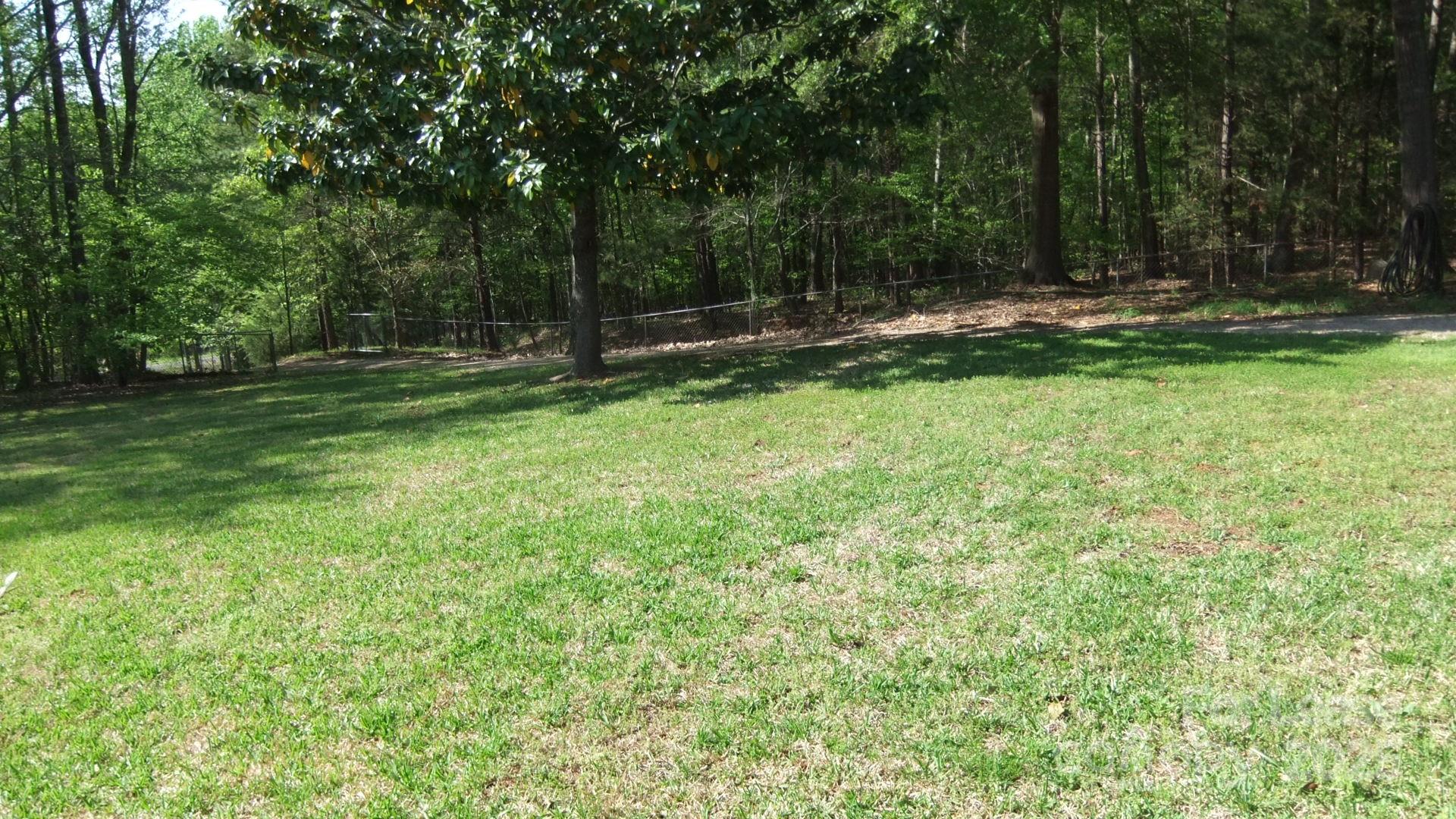 11208 Harrisburg Road Indian Land, SC 29707 - Photo 16 of 16 a view of outdoor space with deck and yard