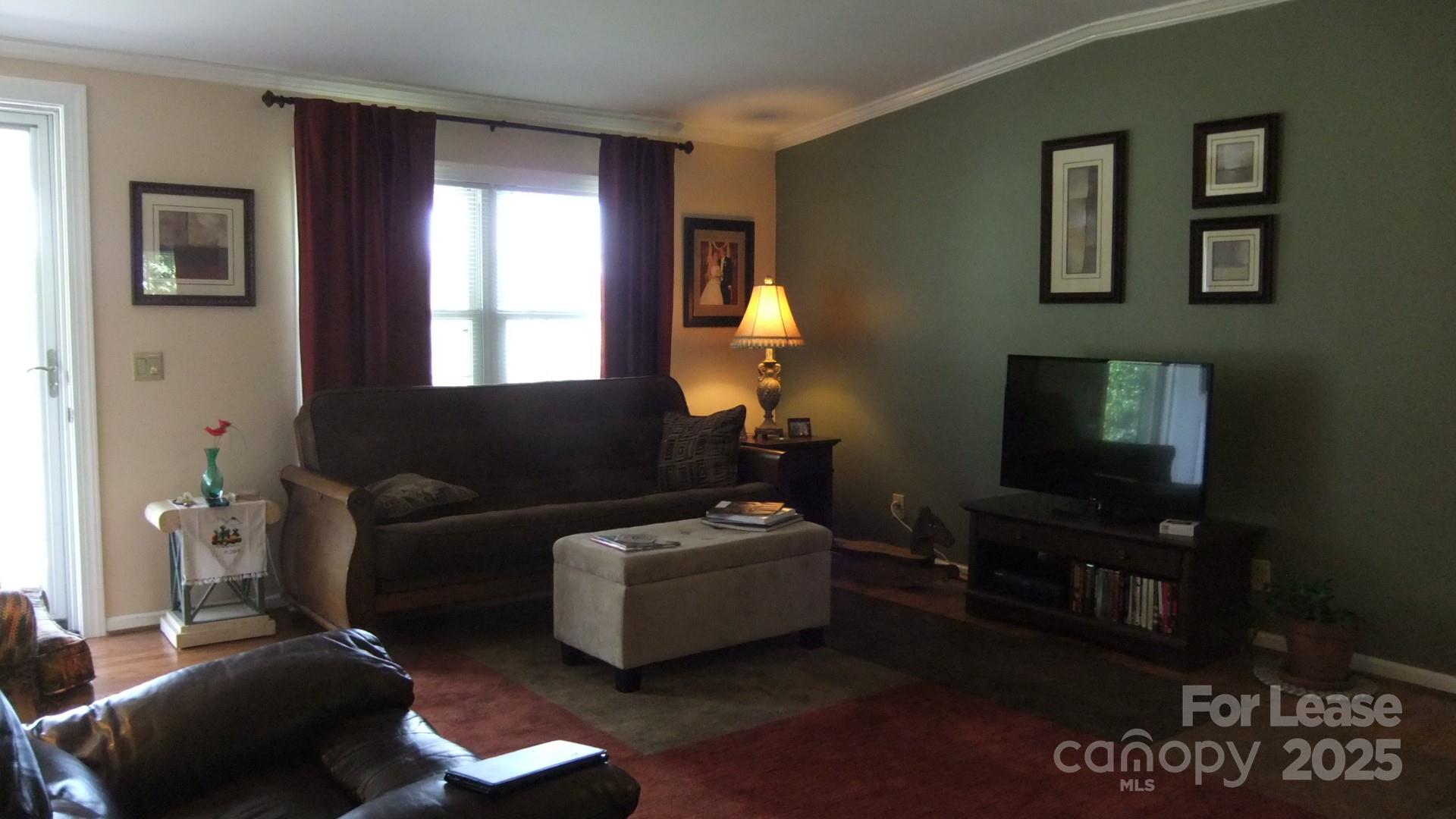 11208 Harrisburg Road Indian Land, SC 29707 - Photo 2 of 16 a living room with furniture and a flat screen tv