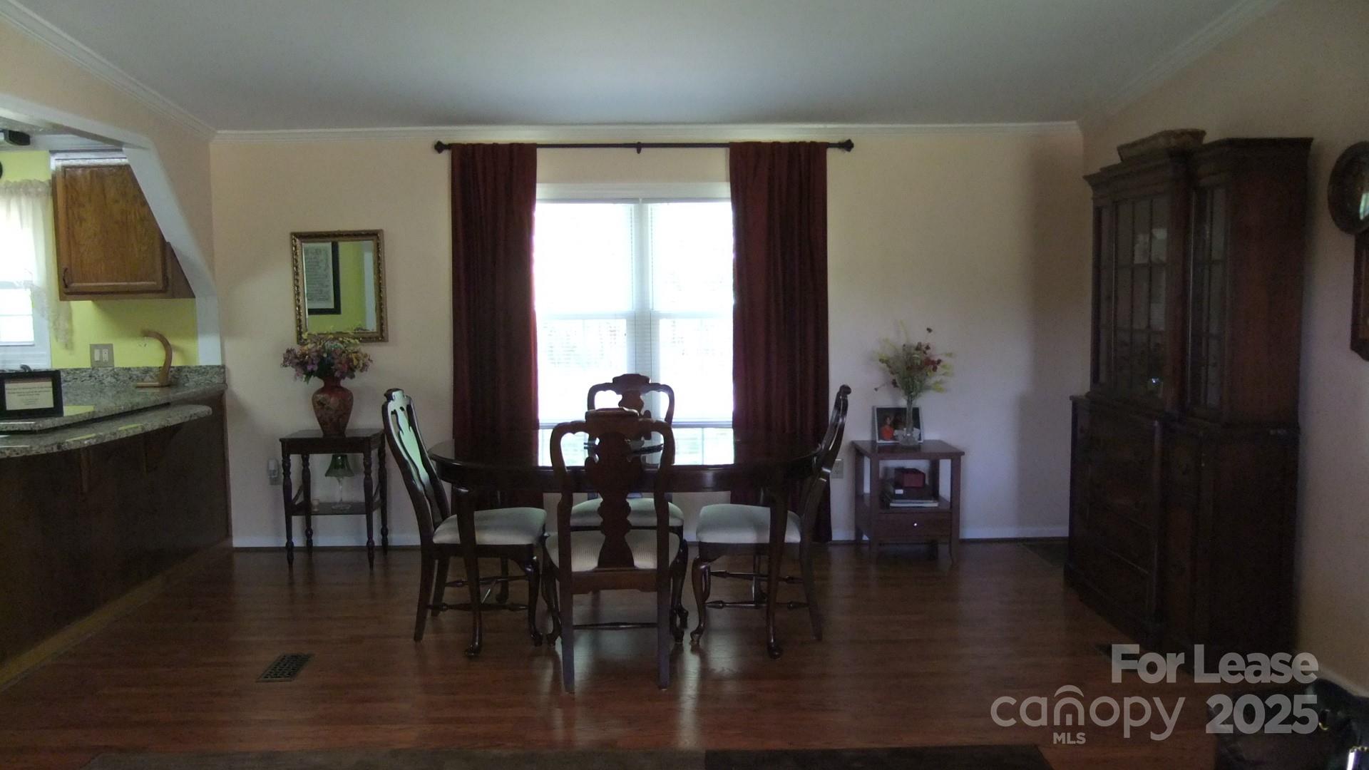 11208 Harrisburg Road Indian Land, SC 29707 - Photo 3 of 16 a view of a dining room with furniture and wooden floor