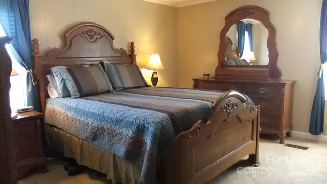 a bedroom with a bed and window