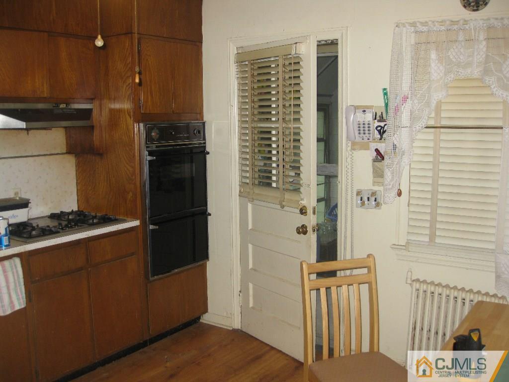 188 Texas Road Old Bridge, NJ 08857 - Photo 3 of 7 a kitchen with granite countertop a refrigerator and a stove