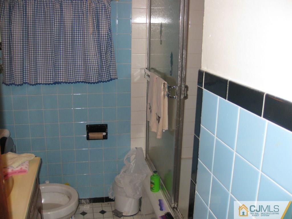 188 Texas Road Old Bridge, NJ 08857 - Photo 5 of 7 a bathroom with a toilet and a shower