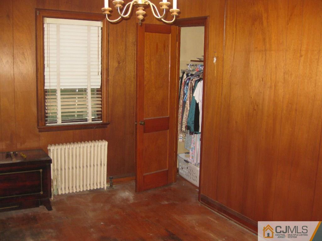 188 Texas Road Old Bridge, NJ 08857 - Photo 7 of 7 a bedroom with a bed and a window