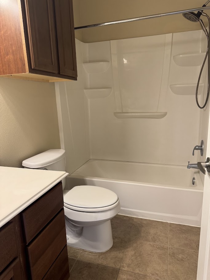 1198 Jones-Butler Road, Unit 1904 College Station, TX 77840 - Photo 12 of 17 Full bath featuring vanity, bathtub / shower combination, and dark tile patterned floors