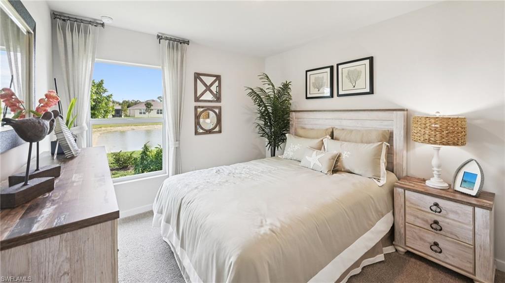 5007 3rd Street West Lehigh Acres, FL 33971 - Photo 21 of 24 Model Home. This room features a window providing views of a body of water and surrounding properties