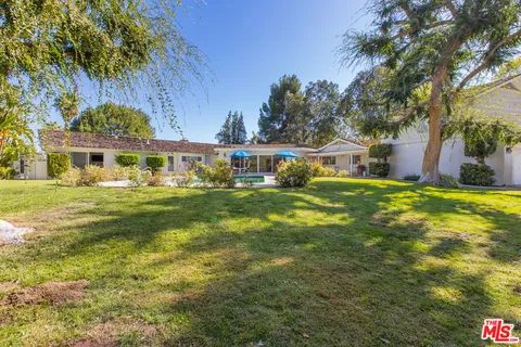 a view of a house with a big yard