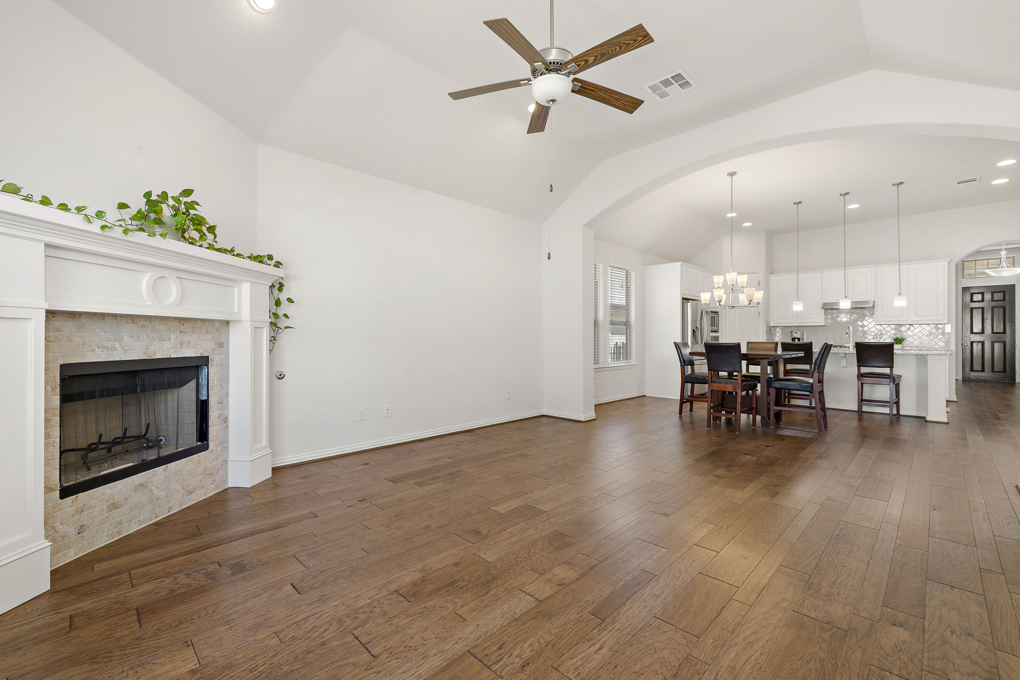 4201 Vespa Cove Leander, TX 78641 - Photo 3 of 29 a view of a dining room with furniture and wooden floor