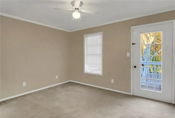a view of an empty room with a window