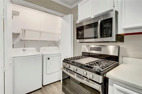 a kitchen with a stove and a microwave