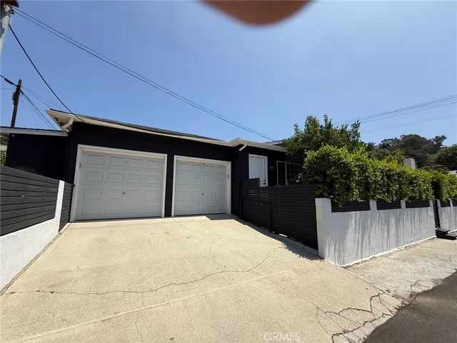 a front view of a house with a garage
