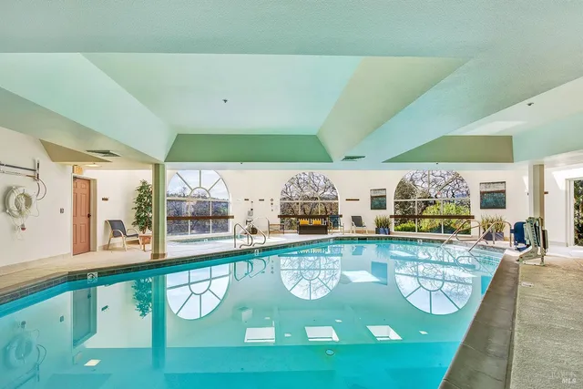 a view of a swimming pool with seating area