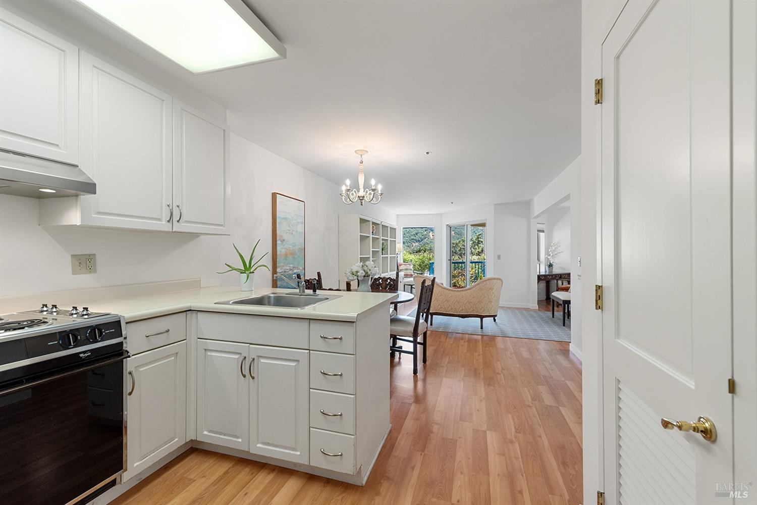 100 Thorndale Drive, Unit 116 San Rafael, CA 94903 - Photo 2 of 27 a kitchen with a sink stove and cabinets