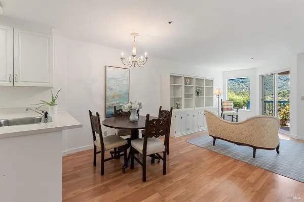 a view of a dining room with furniture window and wooden floor