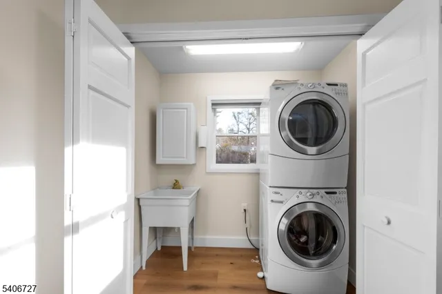 a view of a hallway with washer and dryer